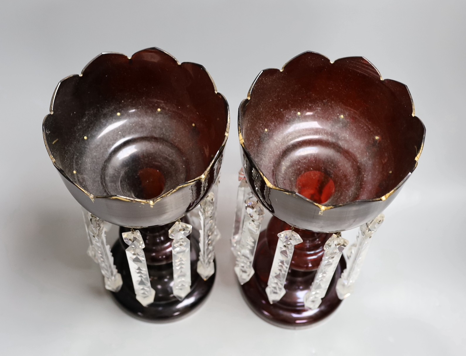 A pair of 19th century ruby glass table lustres, 34cm